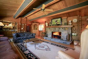 Living Room with Stone Fireplace - Country homes for sale and luxury real estate including horse farms and property in the Caledon and King City areas near Toronto